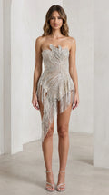 Front view of model wearing silver strapless beaded fringe asymmetrical mini dress