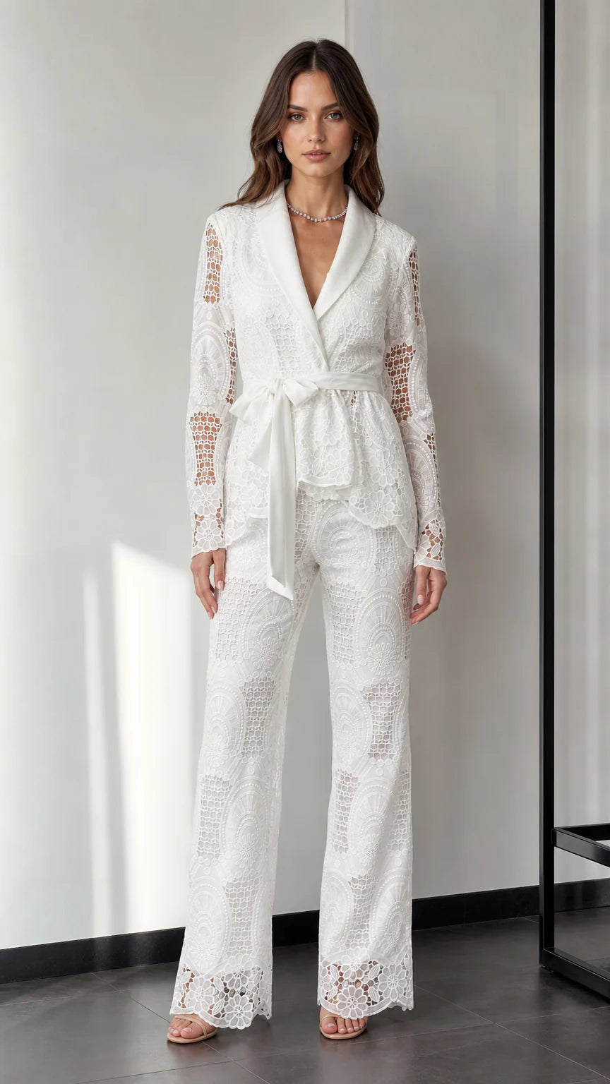 Front view of woman wearing white lace blazer and wide-leg pants set