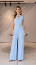 Front view of light blue wide-leg jumpsuit with gold belt
