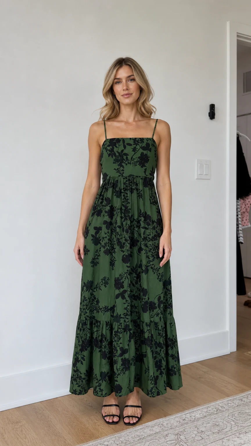 Front view of model wearing green floral maxi dress