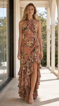 Front view of model wearing rust floral halter maxi dress