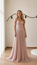 Front view of model wearing blush pink beaded chiffon evening gown
