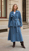 Front full-length view of woman wearing Denim Blue belted trench jacket and matching maxi skirt set