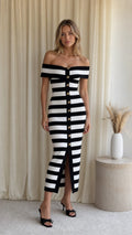 Model wearing black and white striped off-shoulder midi sweater dress from the front