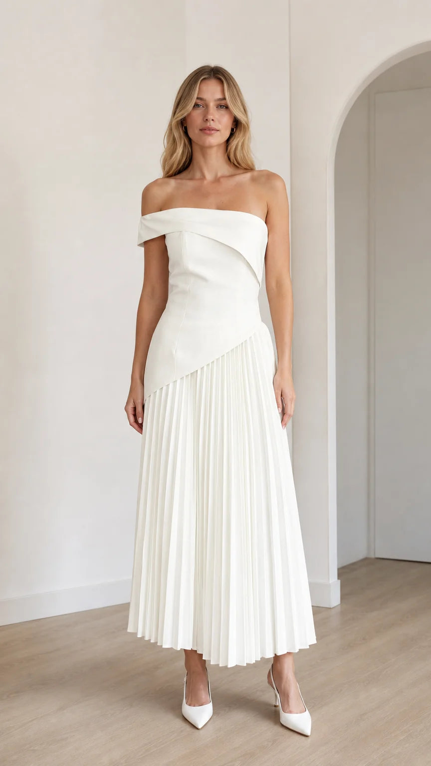 Model wearing white off-shoulder asymmetric pleated midi dress from front