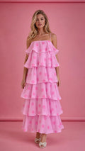Front view of model wearing pink polka dot tiered ruffle midi dress