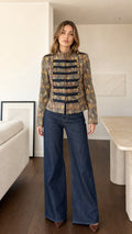 Front view of model wearing Bronze Multi jacquard military band jacket with wide-leg jeans