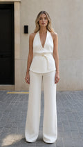 Front view of model wearing white halter top and wide leg pants set