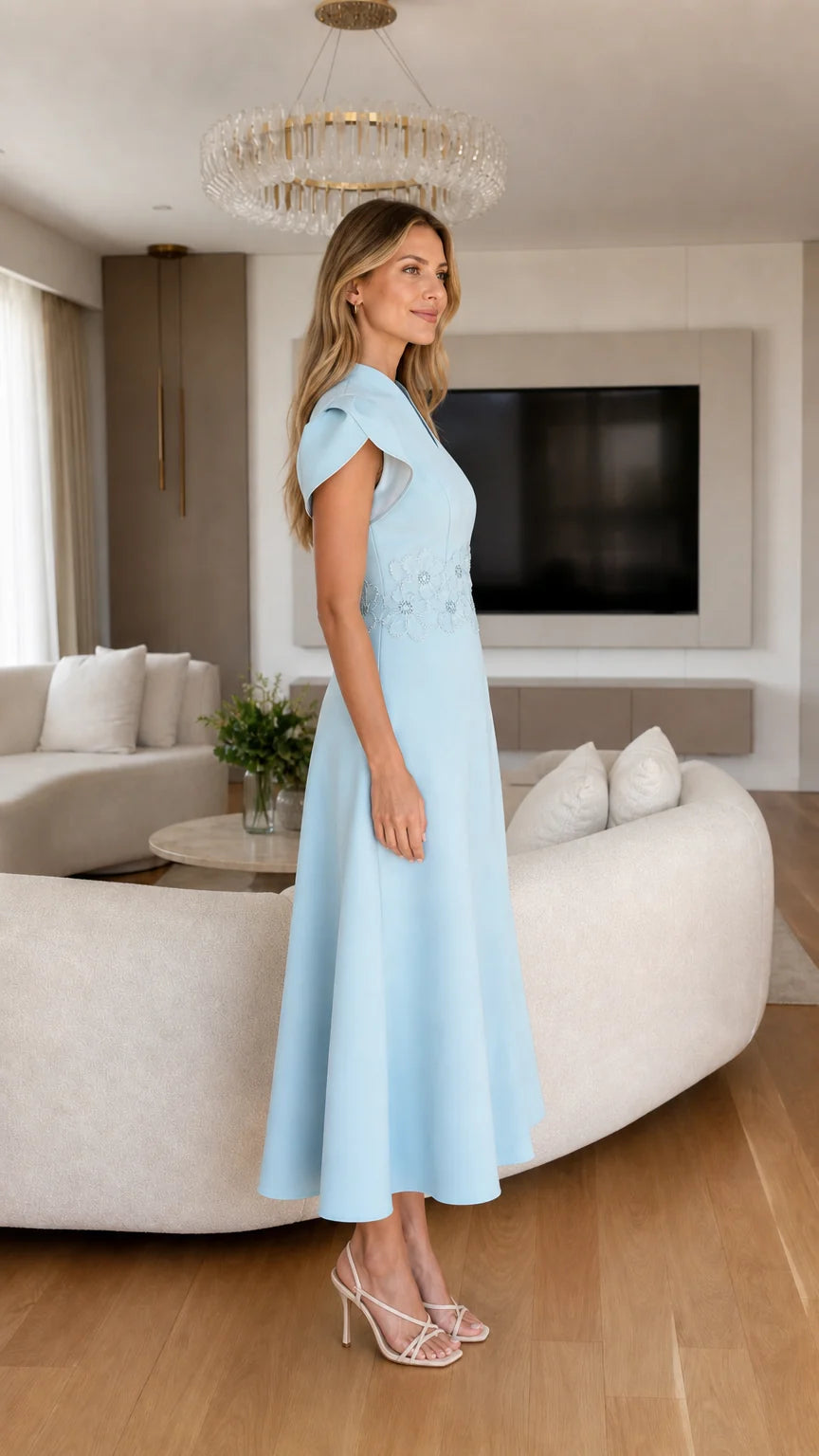 Side profile of light blue midi dress with cap sleeves
