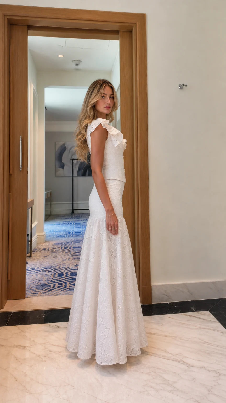 Model wearing white lace matching set, side profile view