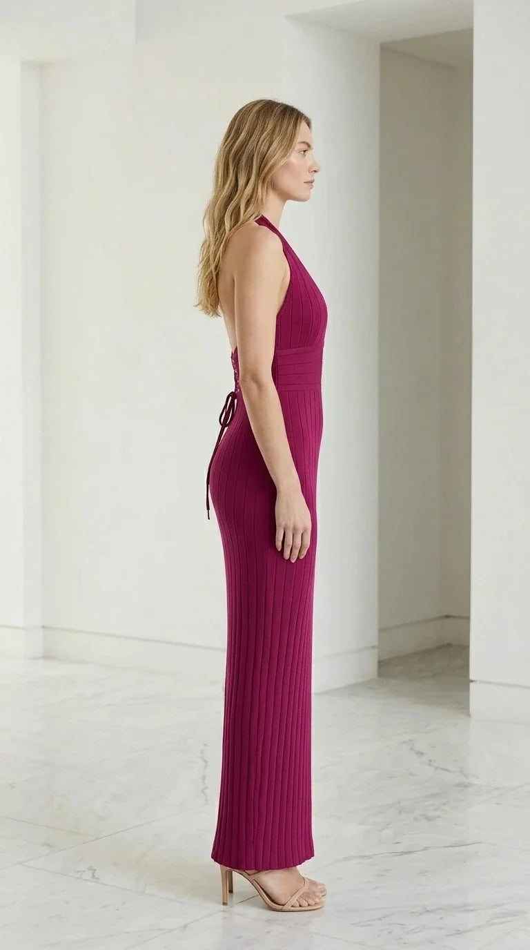 Side profile view of magenta halter dress