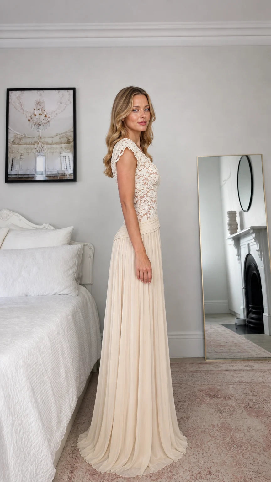 Side profile view of champagne long pleated evening gown