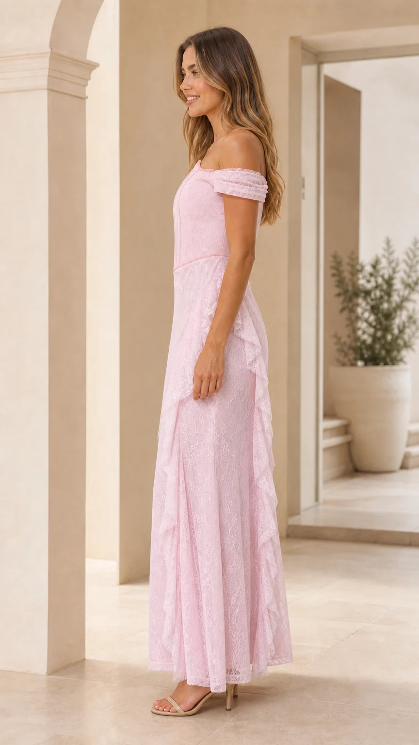 Side profile view of pink lace maxi dress