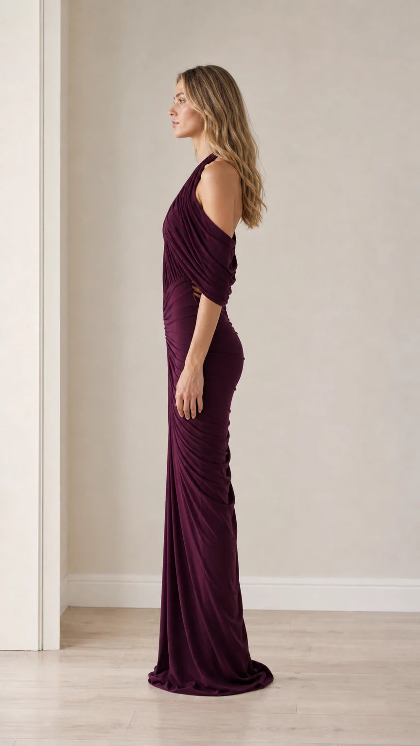 Side profile view of the plum evening gown