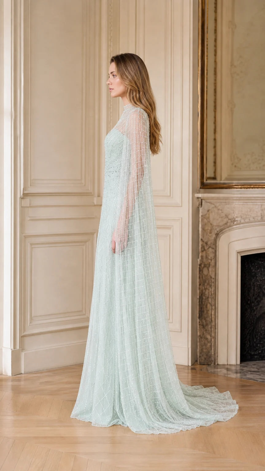 Side profile of sage green formal gown with cape