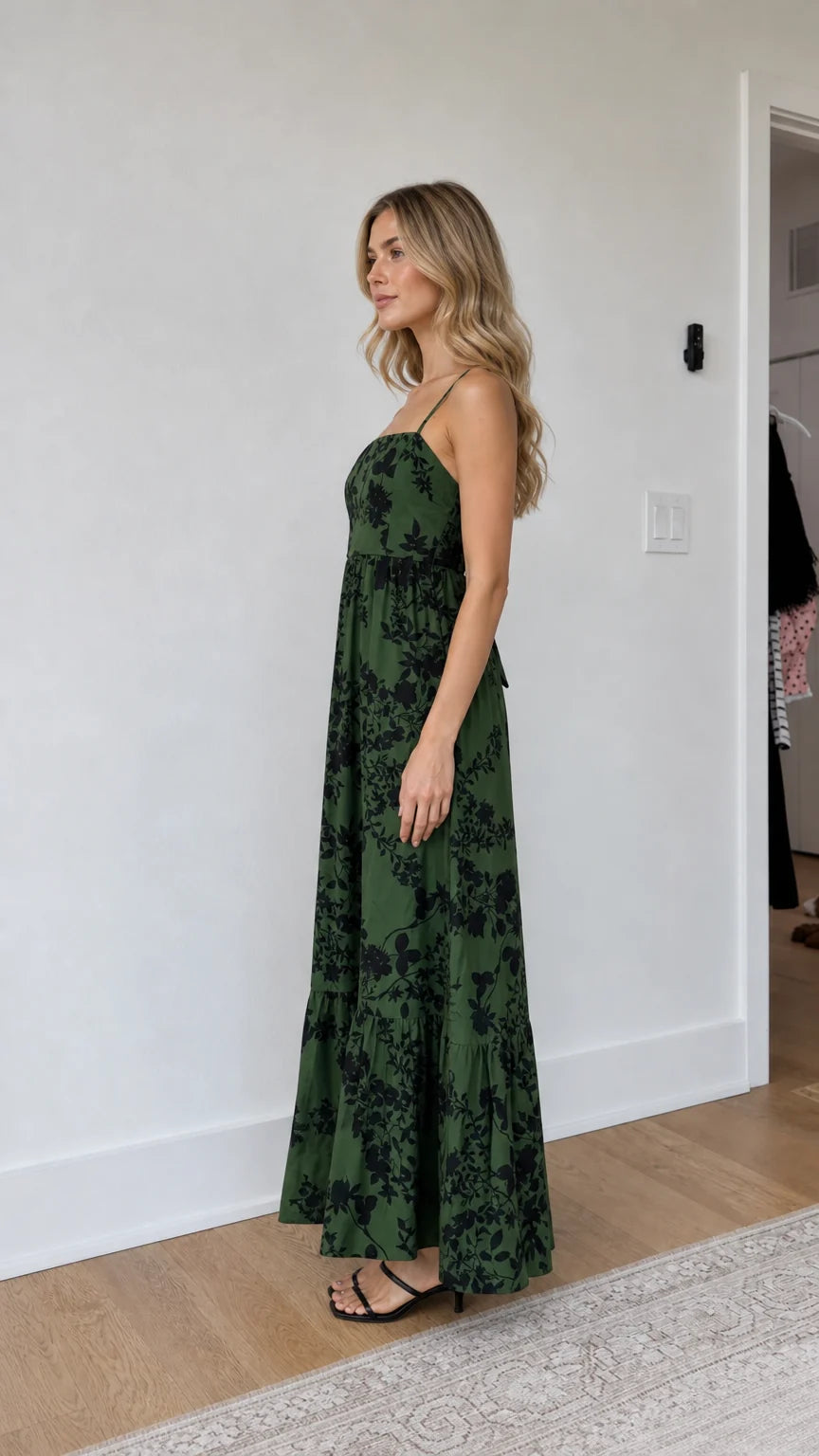 Side profile of model wearing green floral maxi dress