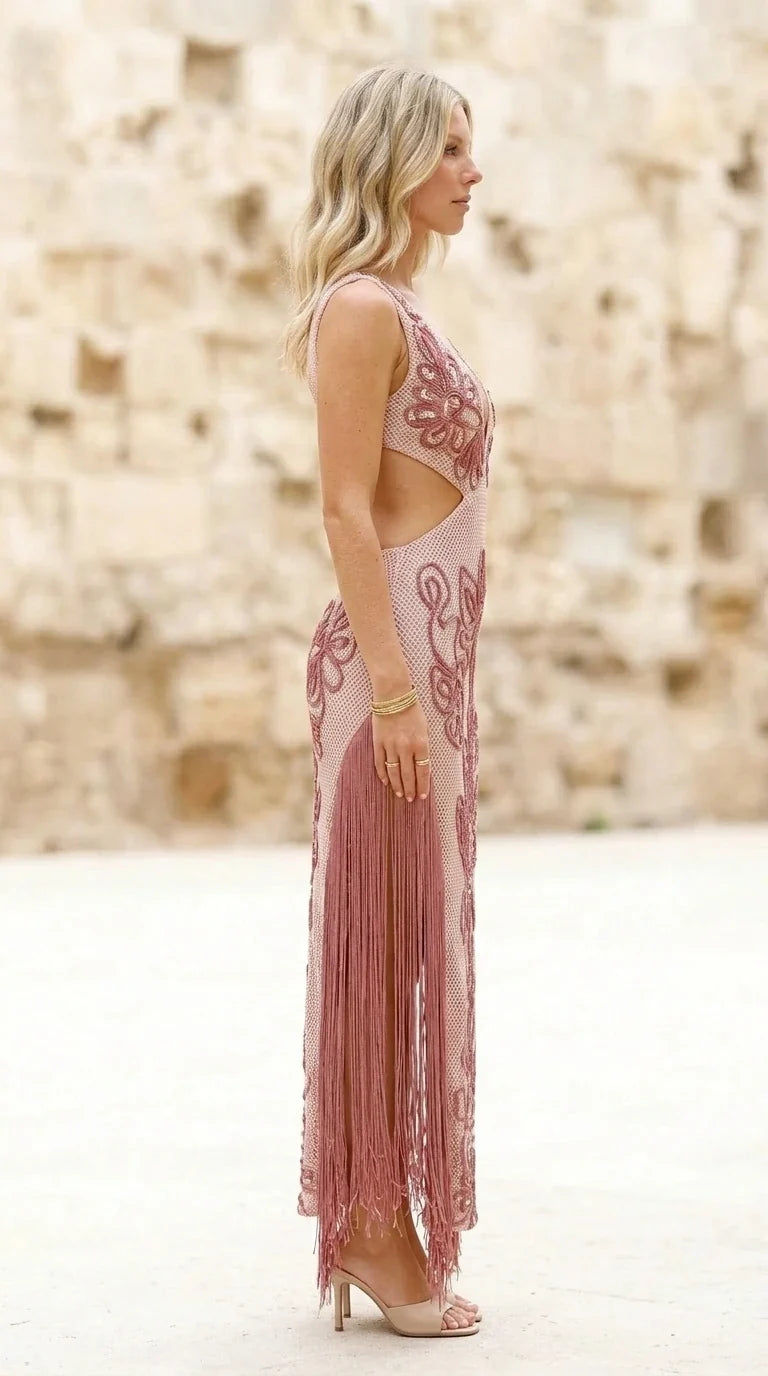 Side profile of model in pink fringe dress