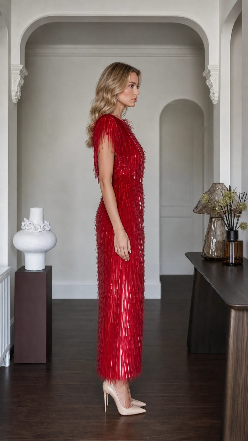 Side profile view of red fringe maxi dress