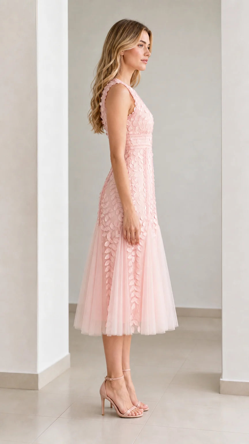 Side profile view of pink midi dress