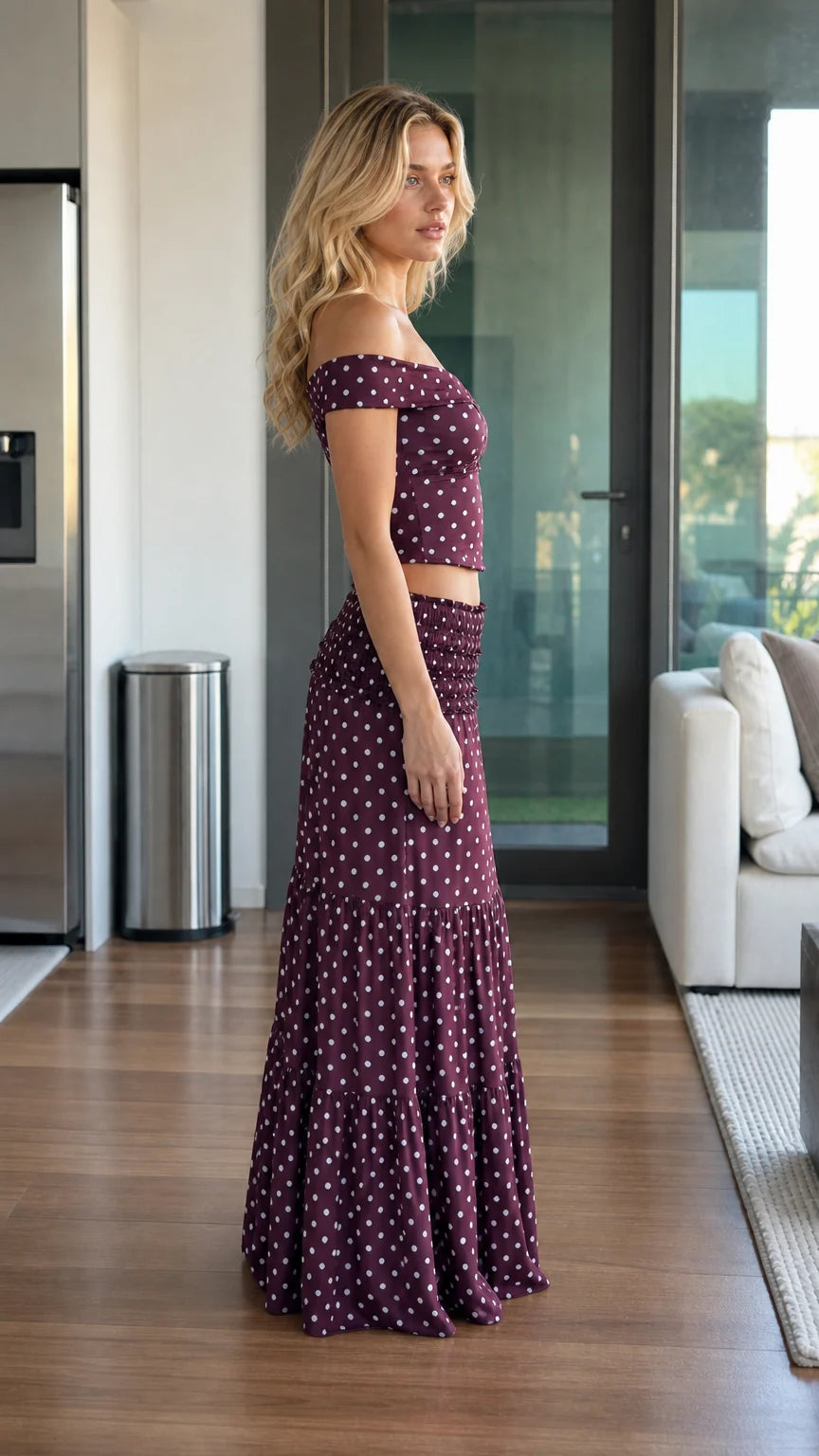 Side profile of model wearing burgundy two piece set