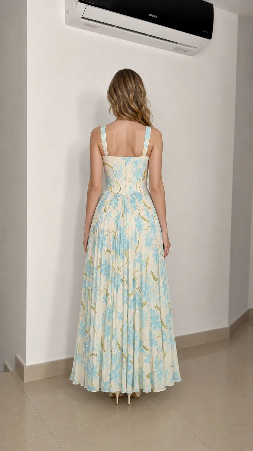 Model wearing ivory floral maxi dress from the back