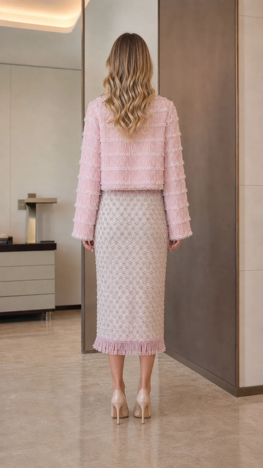 Model wearing pink tweed set back view