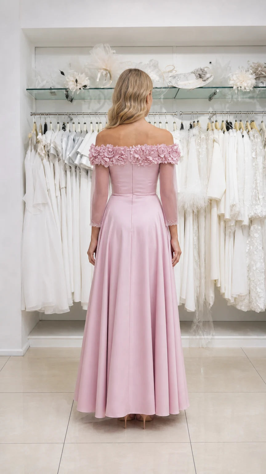 Model wearing pink formal dress, back view