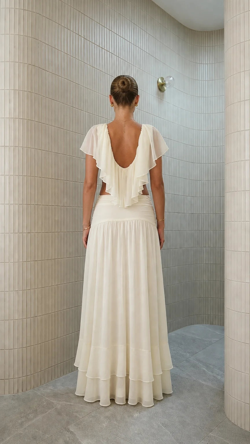 Back view of ivory two-piece set with backless ruffle detail