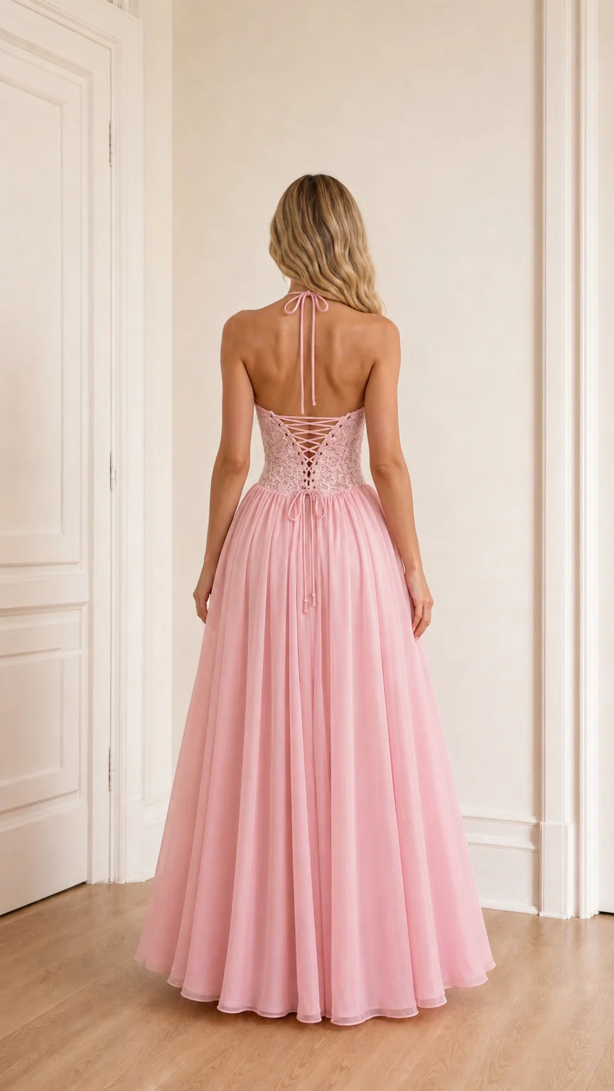 Model wearing pink evening dress back view showing lace-up detail