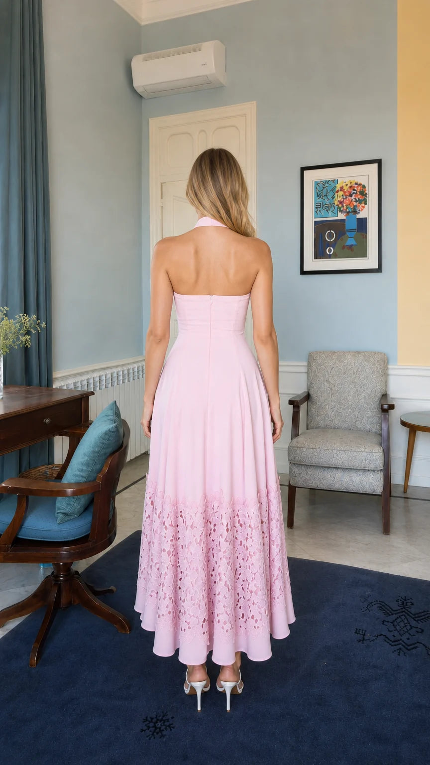 Back view of model wearing pink halter neck long dress