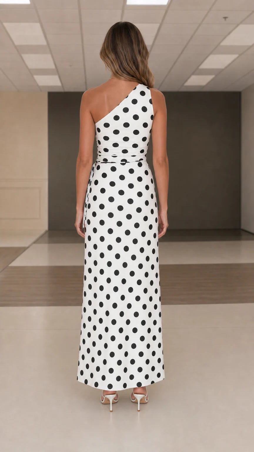 Back view of white polka dot one shoulder maxi dress