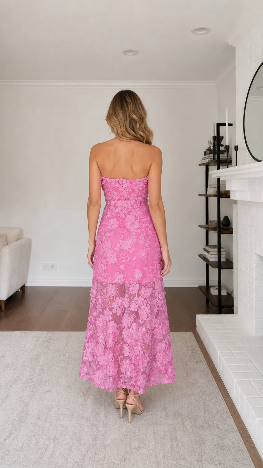 Back view of model showcasing back profile of pink maxi dress