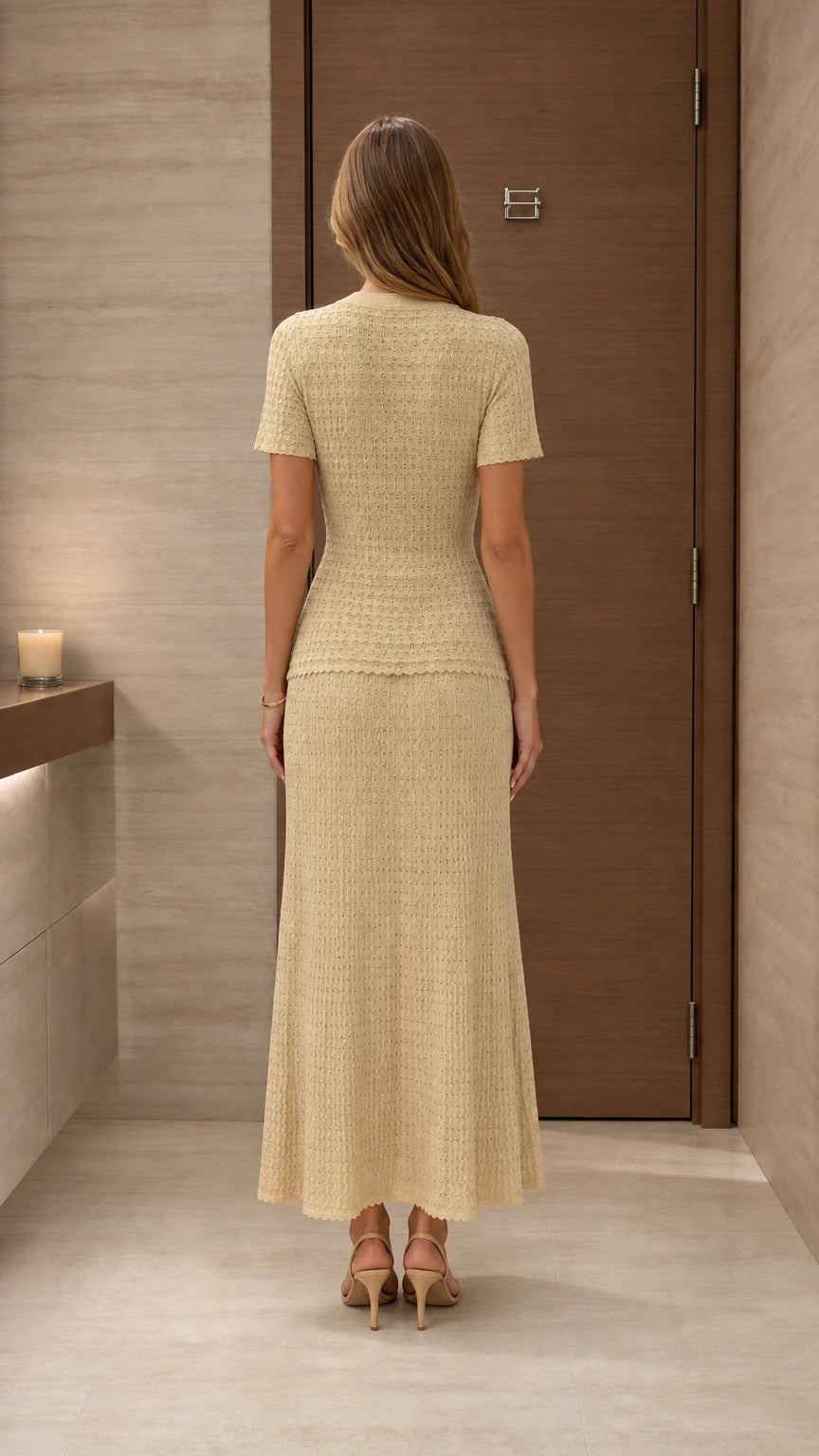 Model wearing beige knit two-piece set from the back