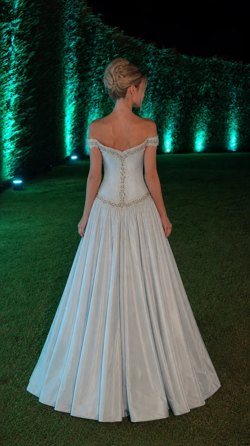 Back view of light blue ball gown showing corset-style back and skirt volume