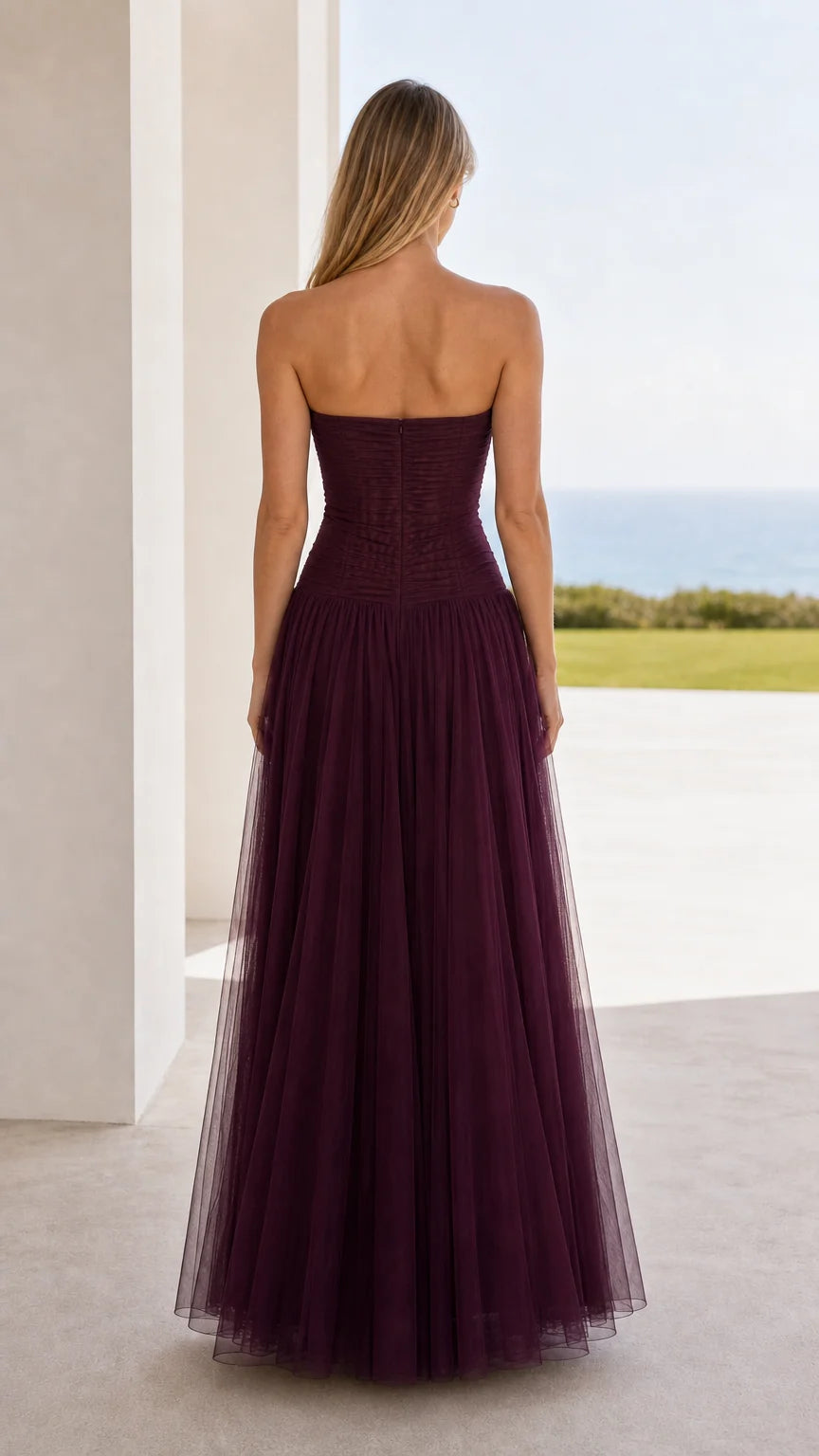Back view of burgundy strapless ruched tulle maxi dress