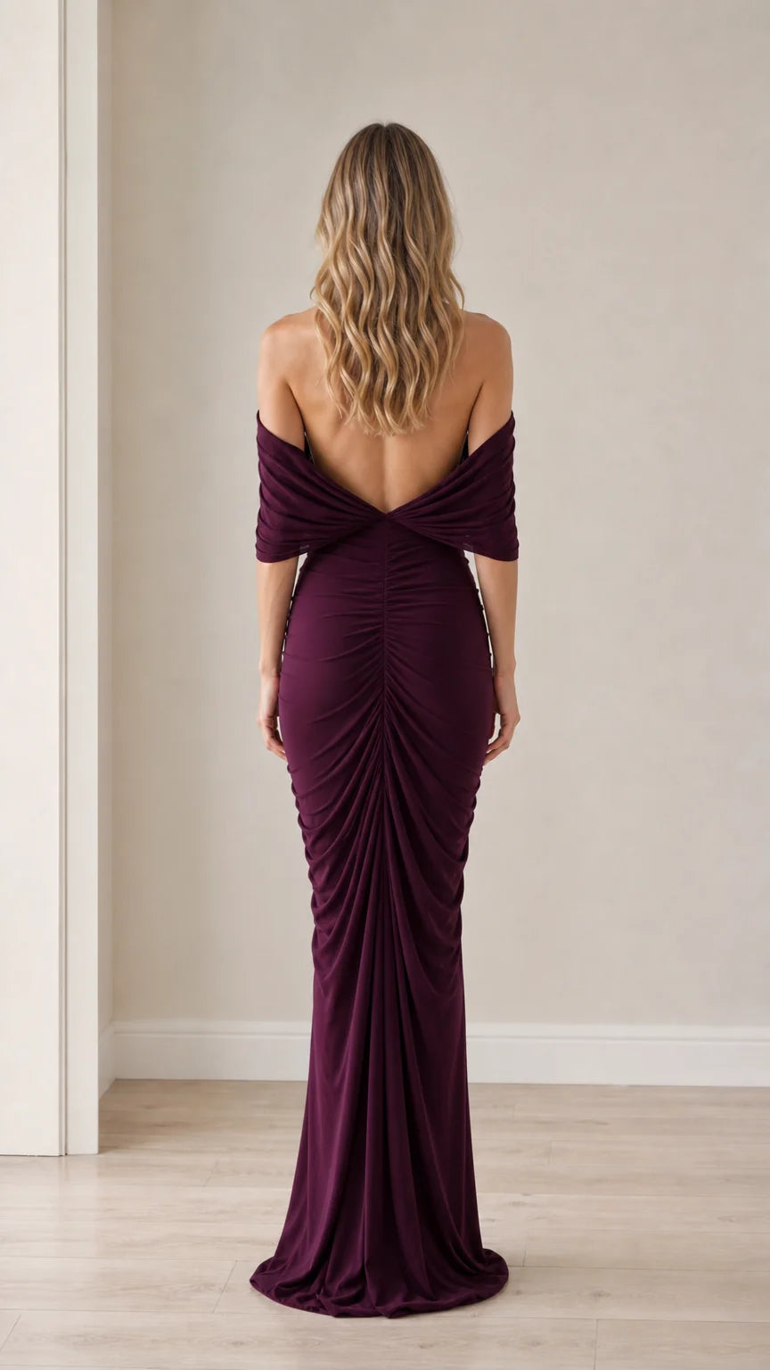 Back view showcasing the open back and draping