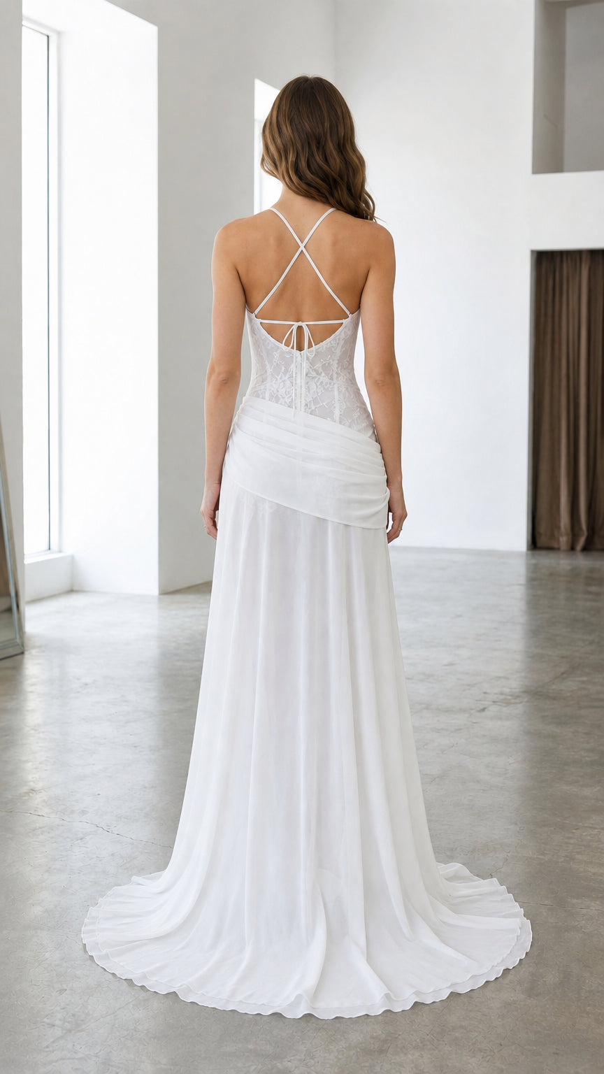 Back view of white lace formal gown showing crisscross strap back detail