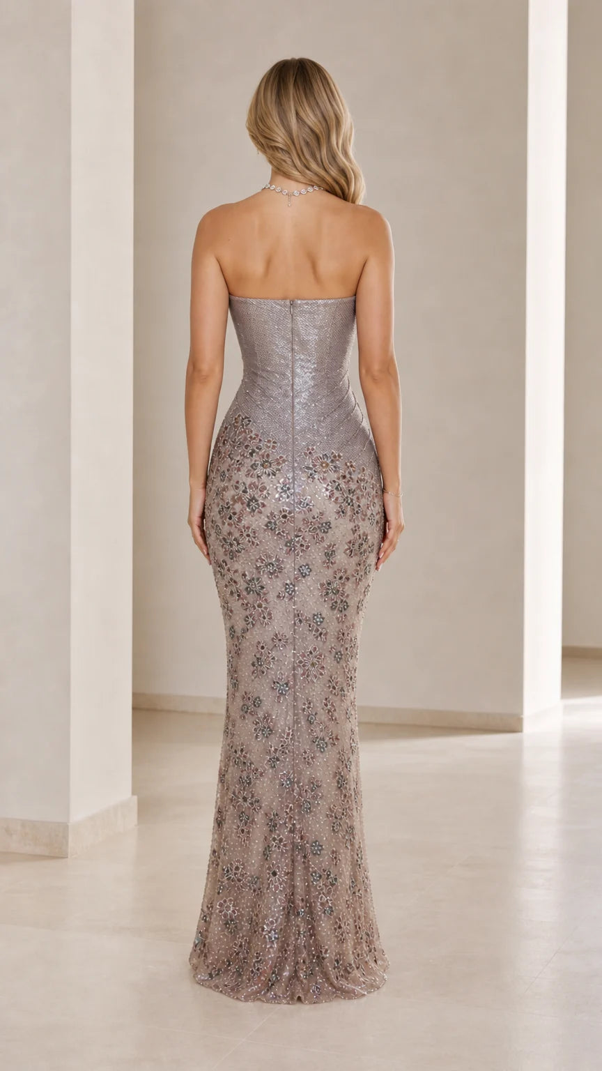Back view of the silver floor-length strapless evening gown