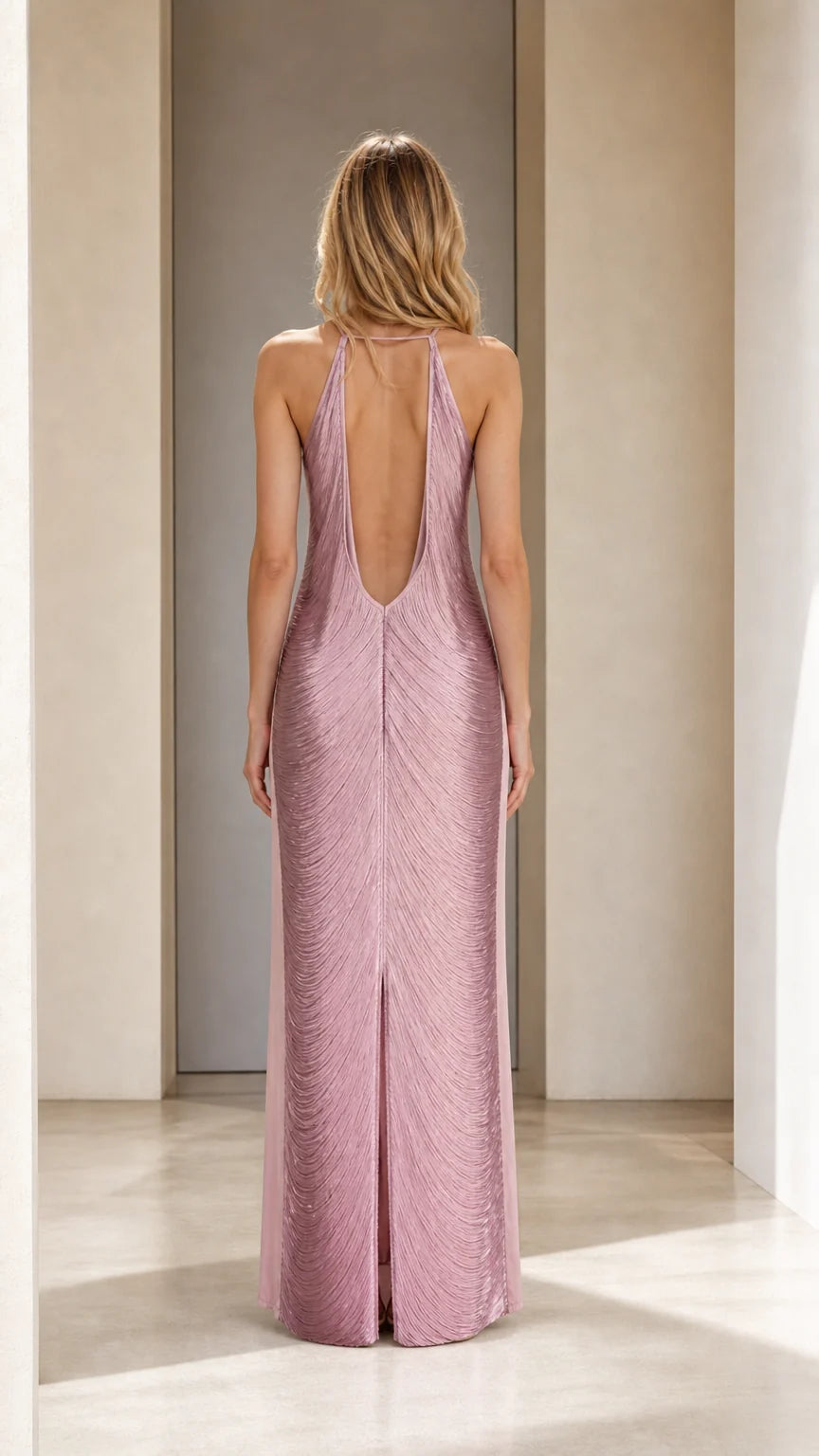 Back view of model showing open back design of mauve maxi dress