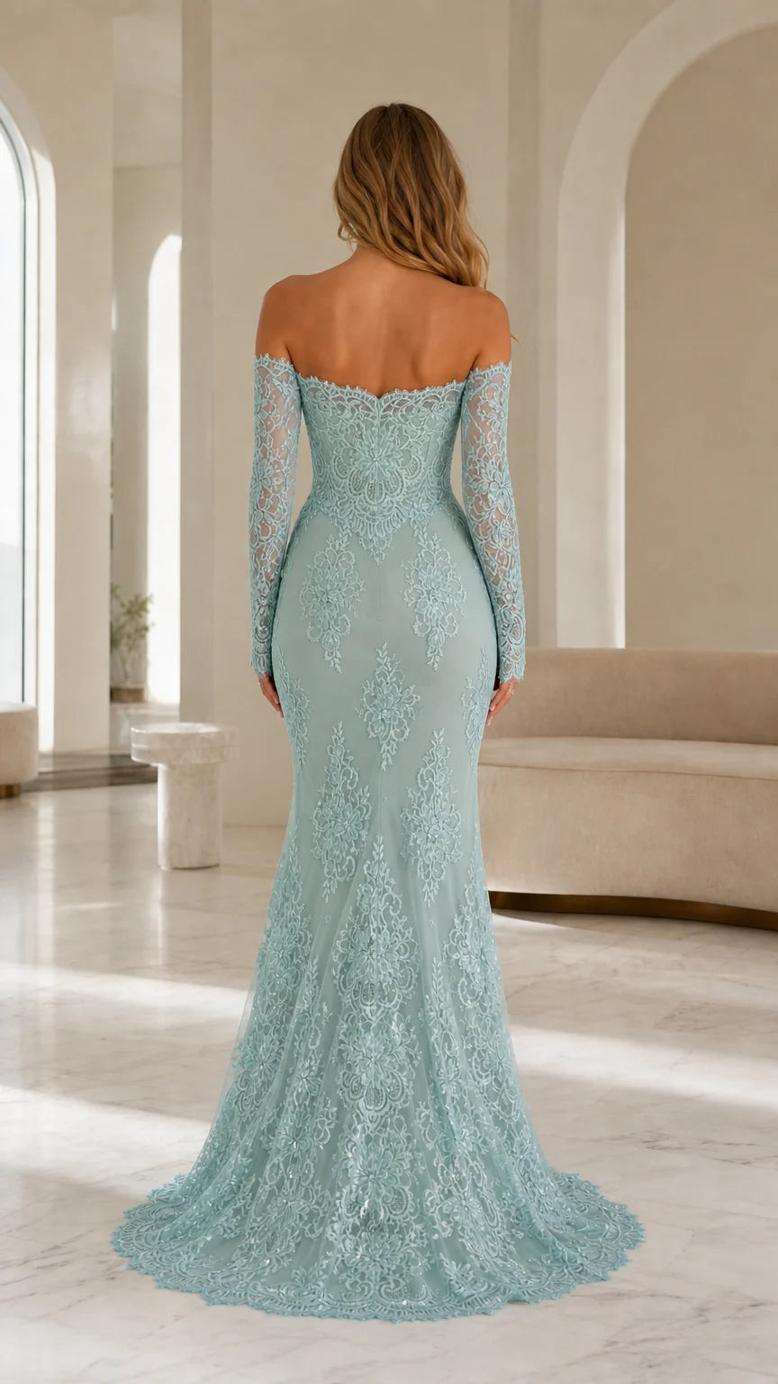 Back view of model showing sweep train on sage lace gown