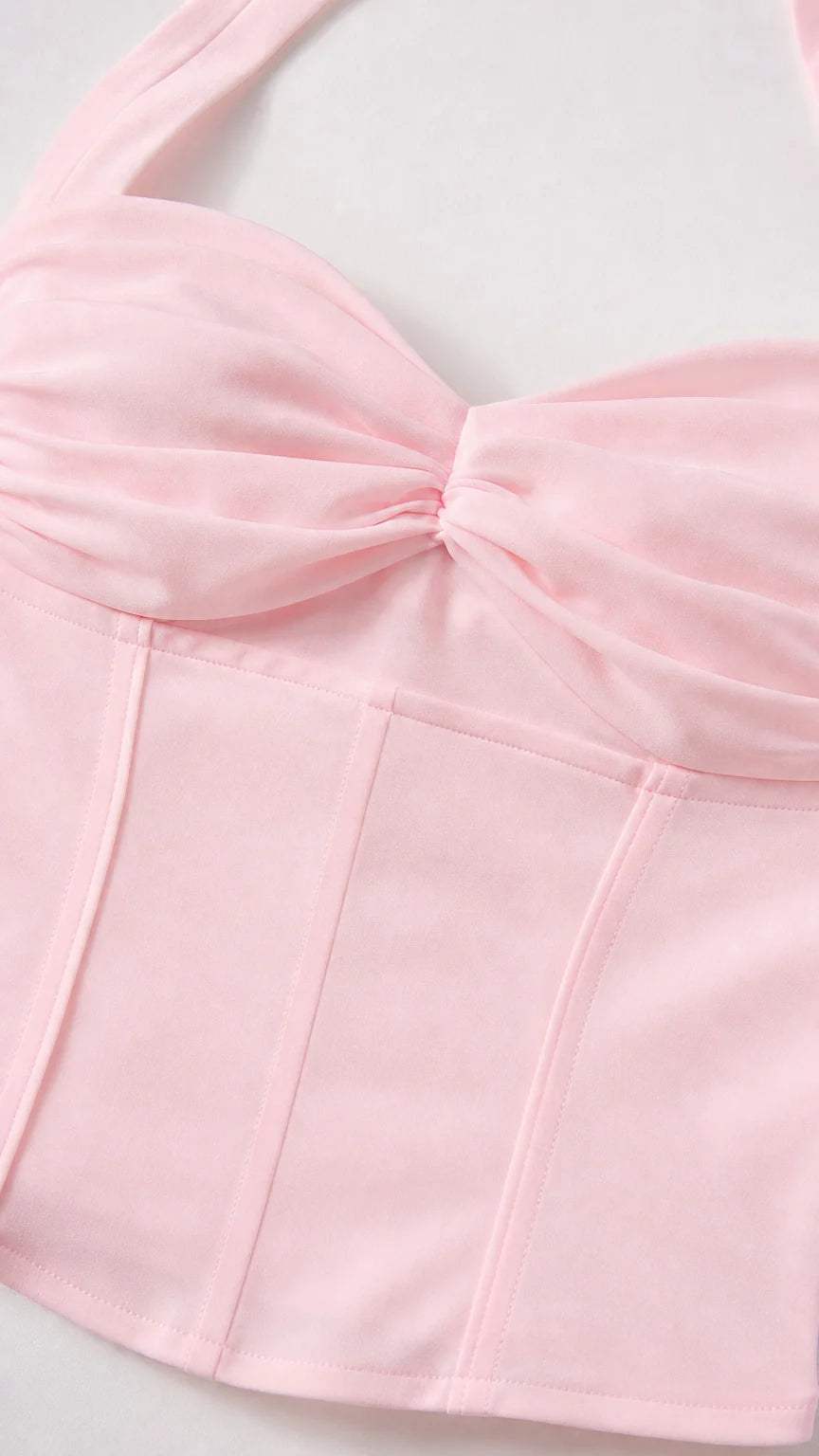Close up of pink corset top bodice and twist detail