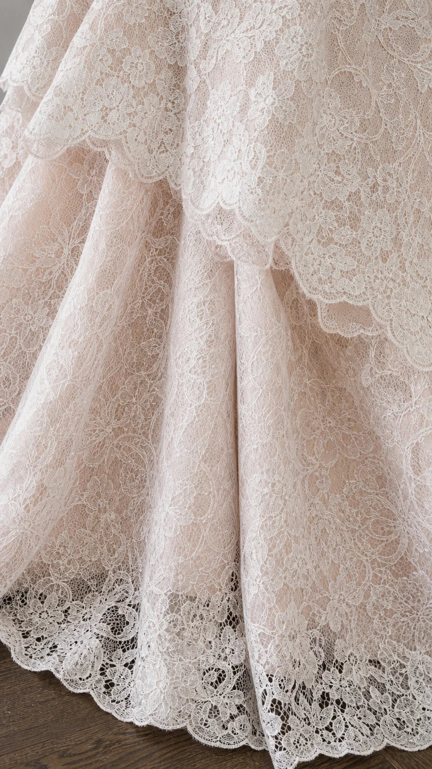 Close up detail of layered scalloped lace hem