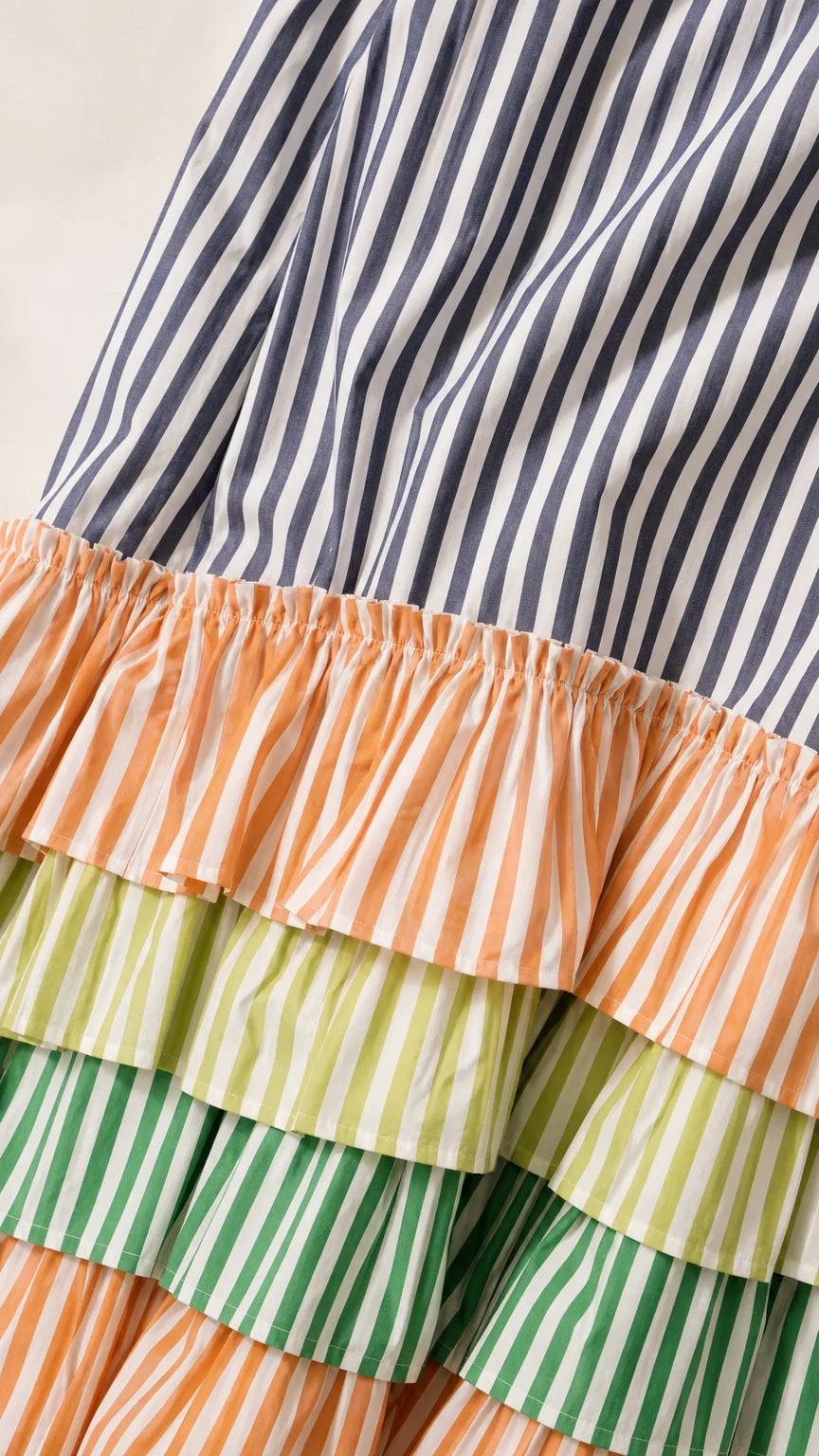 Close-up detail of the striped multi-tiered ruffle hem