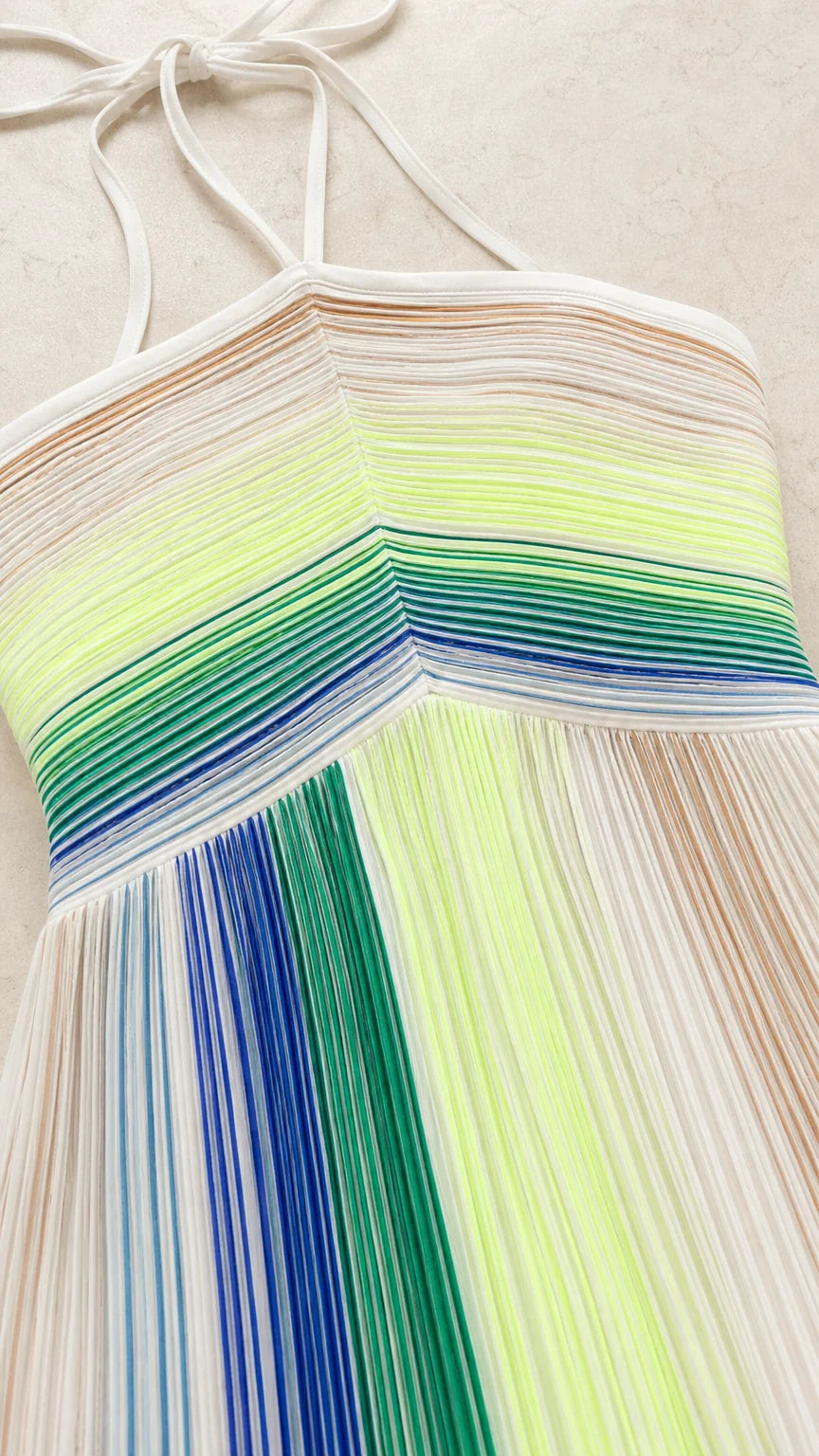 Close-up detail of chevron bodice and vertical pleats