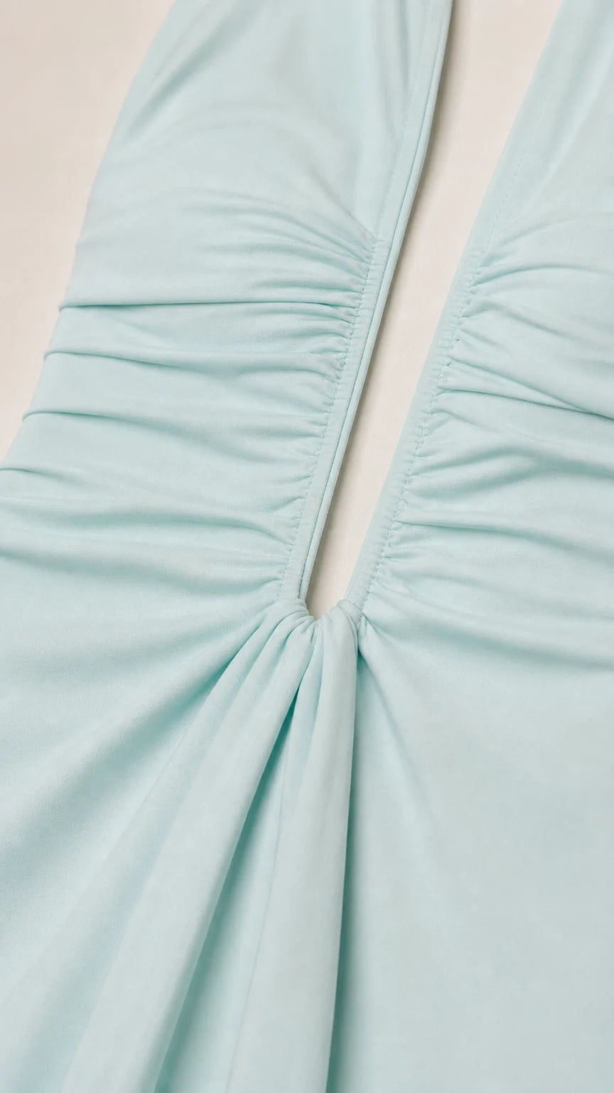 Close-up detail of gathered fabric and neckline