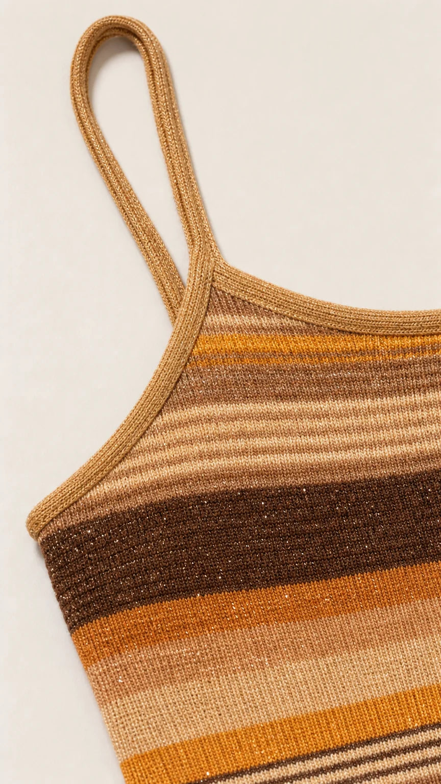 Close-up detail of strap and knit texture on camel dress