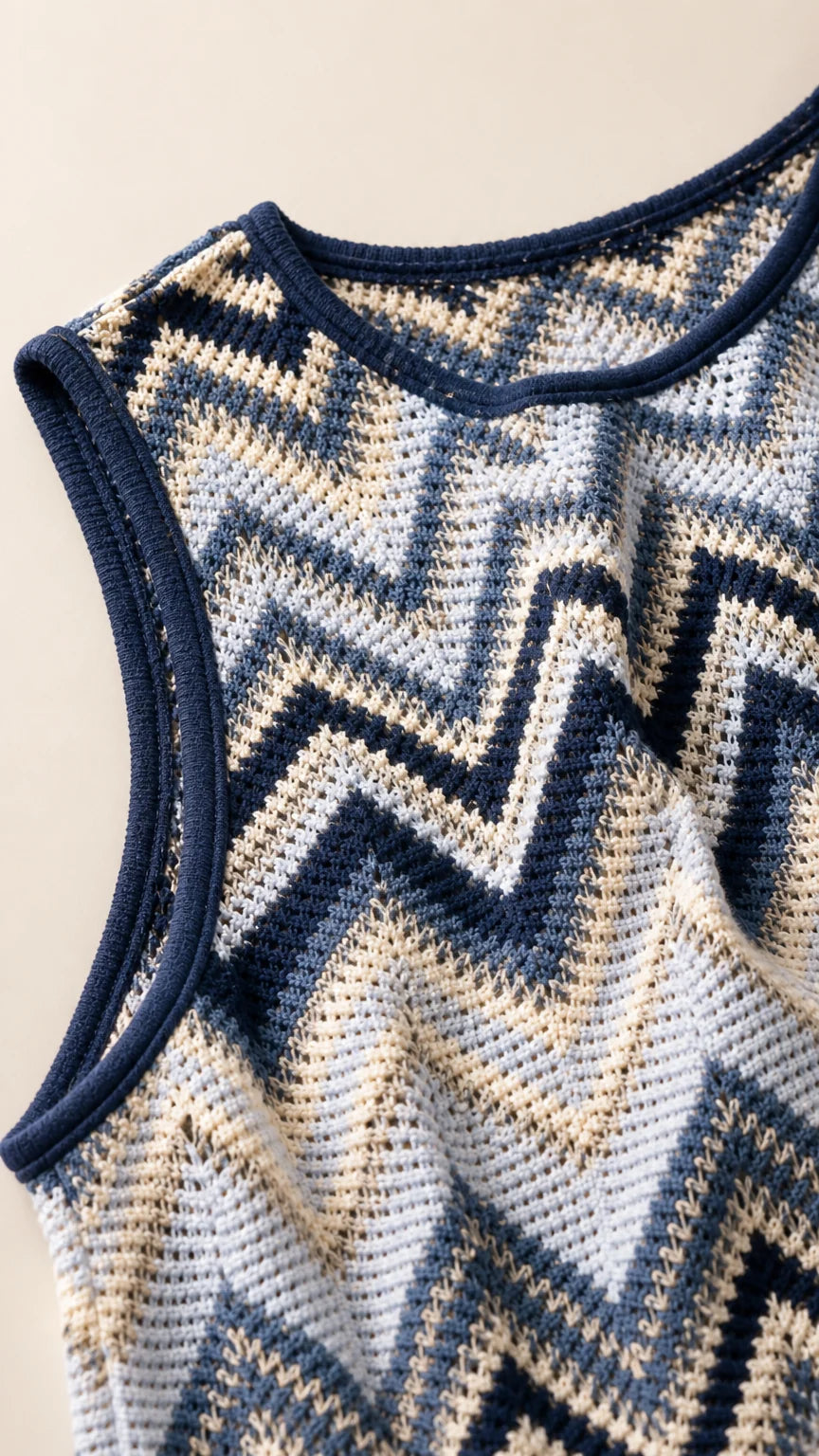 Close-up detail of blue chevron knit fabric and neckline