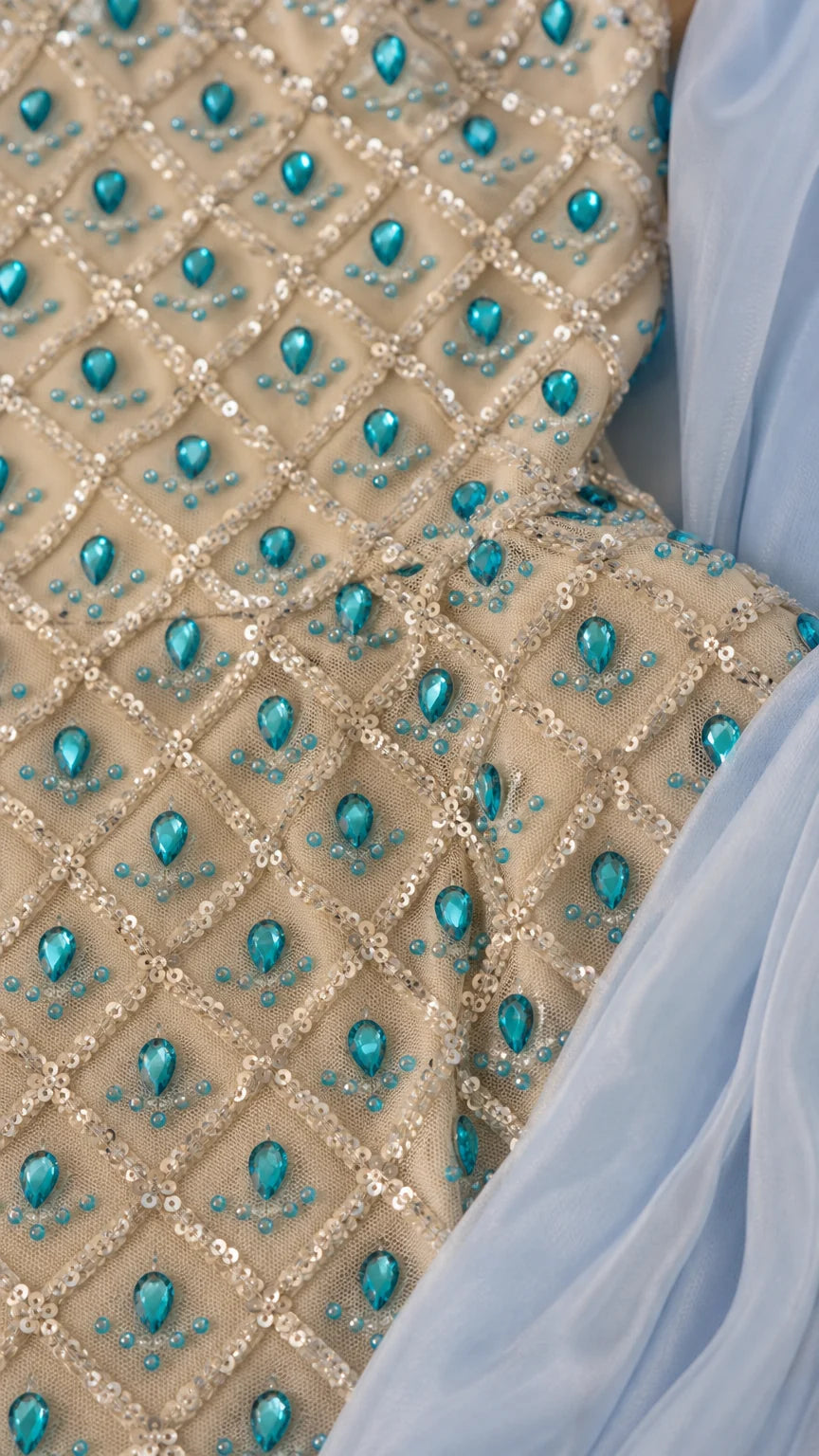 Close-up detail of rhinestone and turquoise crystal beadwork