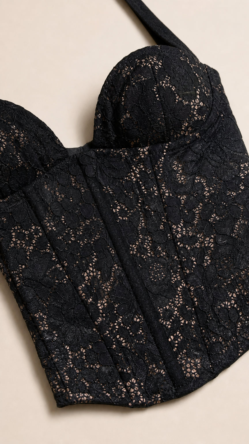 Close-up detail of Black lace corset bodice with sweetheart neckline and boning