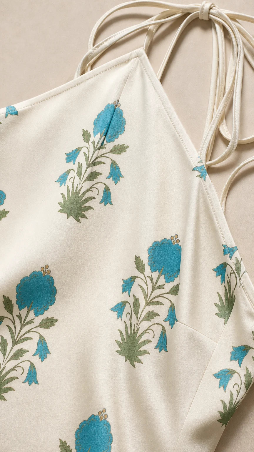 Close-up detail of blue floral pattern on white fabric